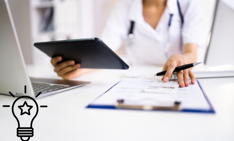 A dentist or healthcare professional using a tablet and calculator while reviewing documents, illustrating efficient dental billing in USA.