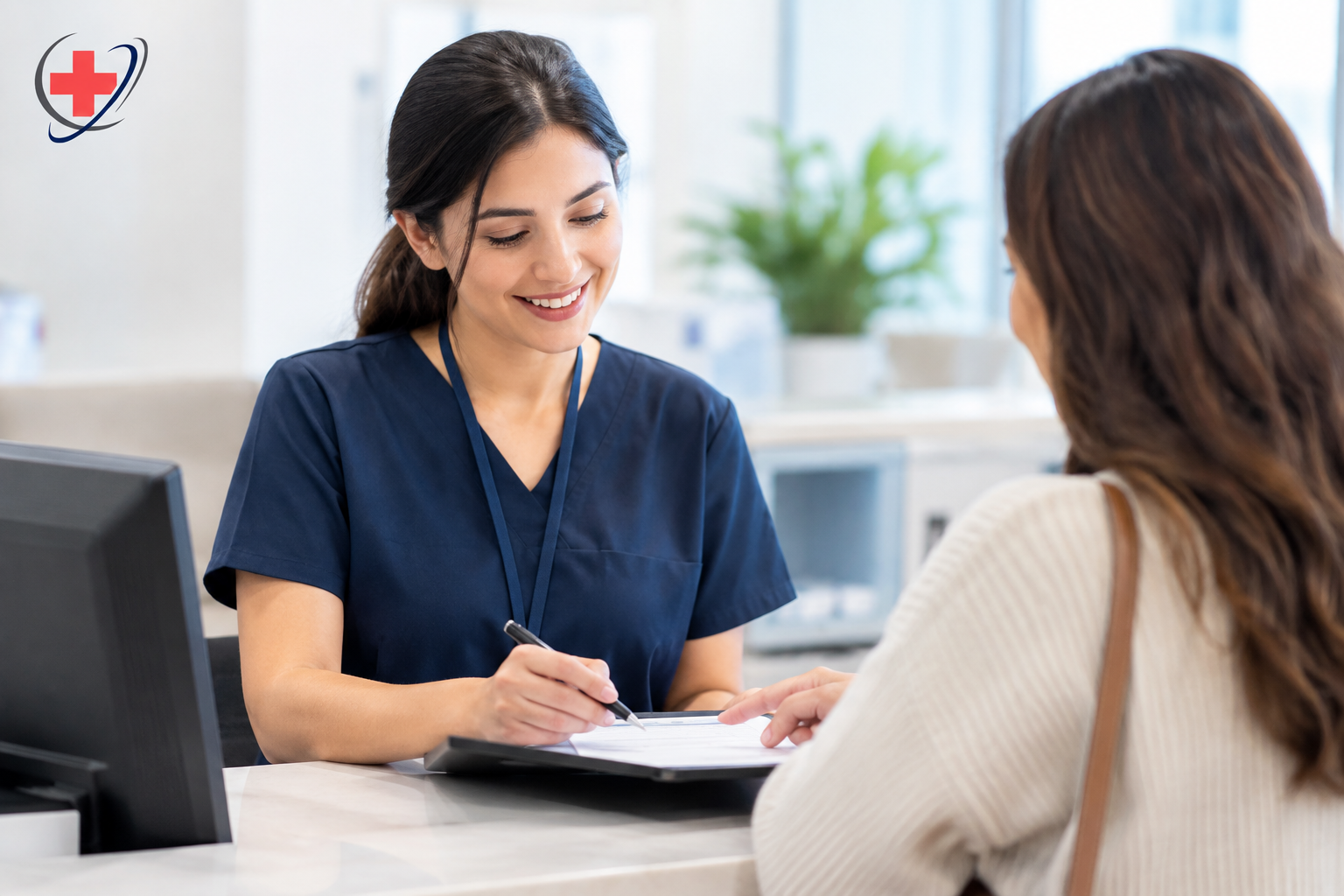 Medical staff member reviewing insurance information with a patient at a clinic reception